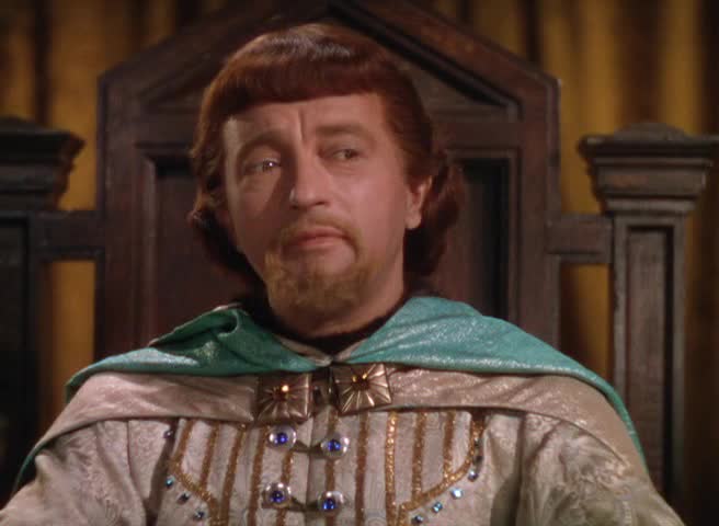 Claude Rains spiller Prince John, kongens maktsyke bror.