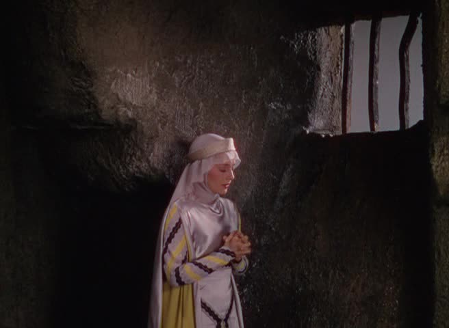 Marion, spilt av Olivia de Havilland, iscenesettes som om hun skulle være en kristen helgen